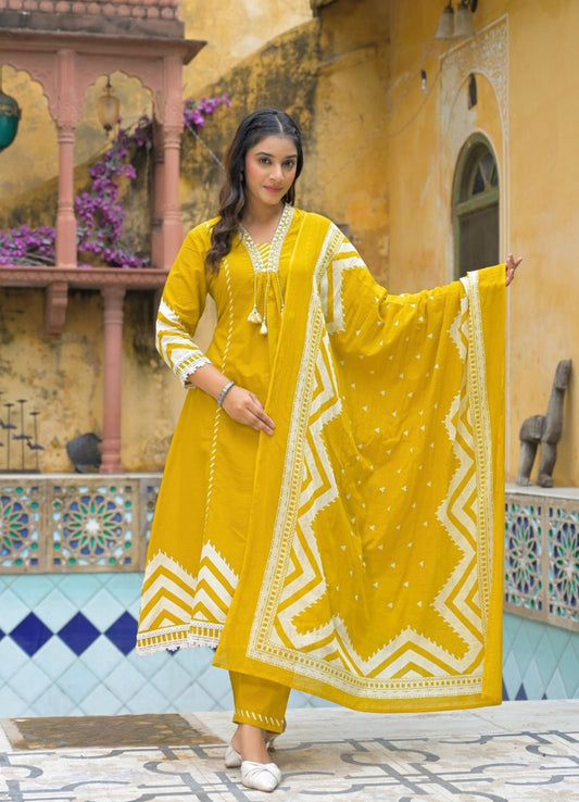 Mustard Yellow Cotton Suit Set with Ethnic Print with Lace & Tassel Detailing