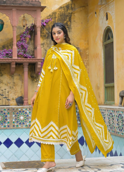 Mustard Yellow Cotton Suit Set with Ethnic Print with Lace & Tassel Detailing