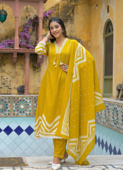 Mustard Yellow Cotton Suit Set with Ethnic Print with Lace & Tassel Detailing