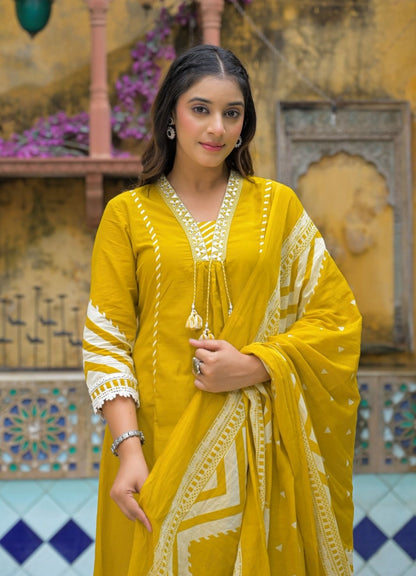Mustard Yellow Cotton Suit Set with Ethnic Print with Lace & Tassel Detailing