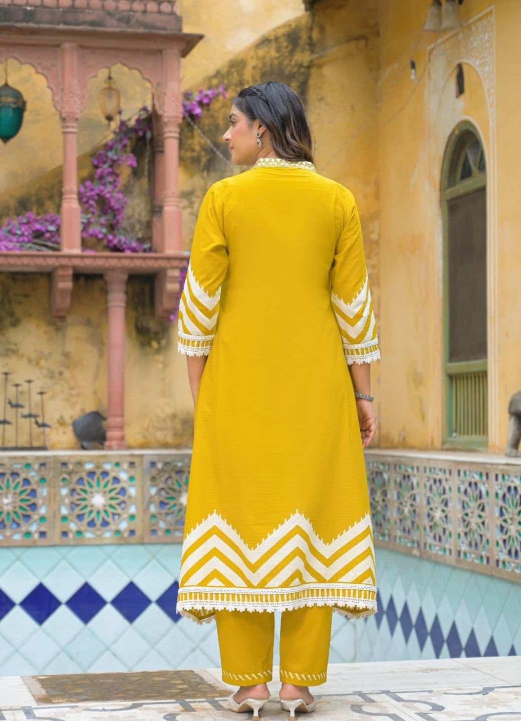 Mustard Yellow Cotton Suit Set with Ethnic Print with Lace & Tassel Detailing